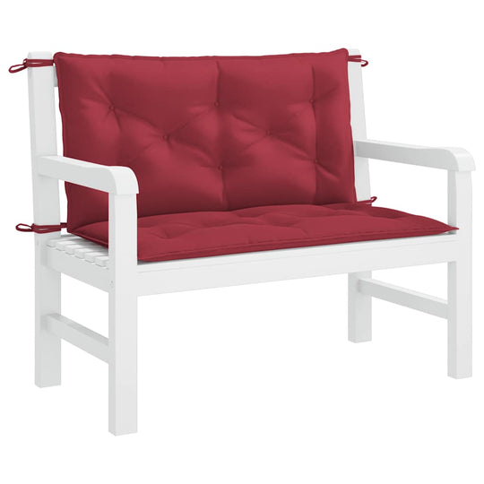 Comfortable wine-colored garden bench cushion on a white wooden bench, perfect for outdoor furniture decor.