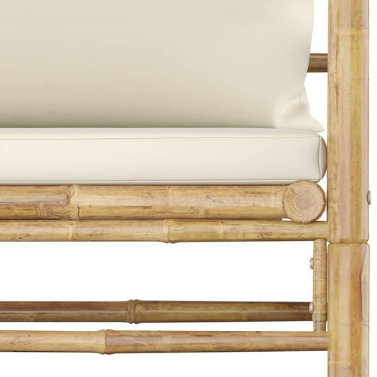 Garden sofa detail with cream white cushions and bamboo frame, perfect for outdoor lounging and comfort.