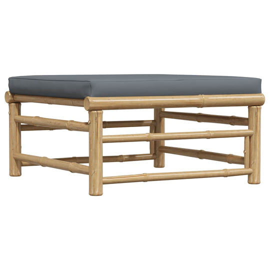 Garden Footrest with Dark Cushion Bamboo on white background, showcasing its sturdy bamboo construction and thick padded dark cushion.