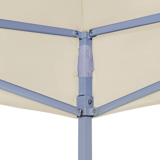 Close-up of the frame connection of a cream party tent roof, showcasing its sturdy support for outdoor furniture and events.