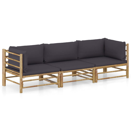3 Piece bamboo garden lounge set with dark cushions, perfect for outdoor seating and relaxation.