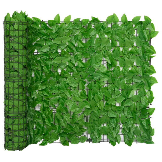 Durable balcony screen with vivid green leaves for privacy and decor, perfect for outdoor furniture setups.