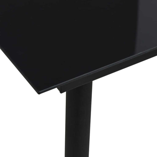 Close-up of sleek black tabletop and sturdy leg of modern dining table, ideal for outdoor furniture and patio settings.