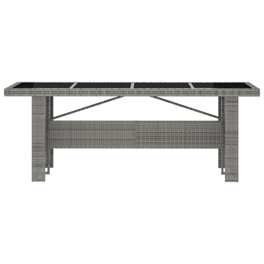 11-piece outdoor dining table in grey poly rattan with glass tabletop, perfect for stylish outdoor gatherings.