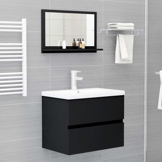 Bathroom with black engineered wood mirror and sleek sink cabinet, showcasing modern décor and functional design.