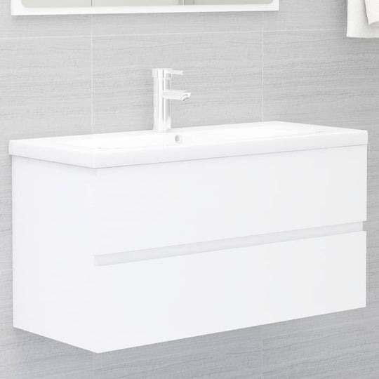 Sleek white sink cabinet with clean lines and two drawers, perfect for modern bathroom storage. Engineered wood design.