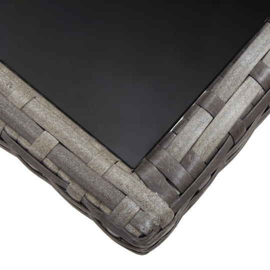 Close-up of the glass tabletop edge of a 7 Piece Garden Dining Set Poly Rattan Anthracite & with woven rattan details.