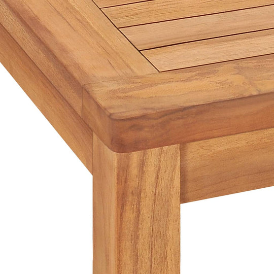 Detail of the 5 Piece Garden Dining Set 140x80 cm Solid Teak Wood showcasing the smooth finish and durability of teak.