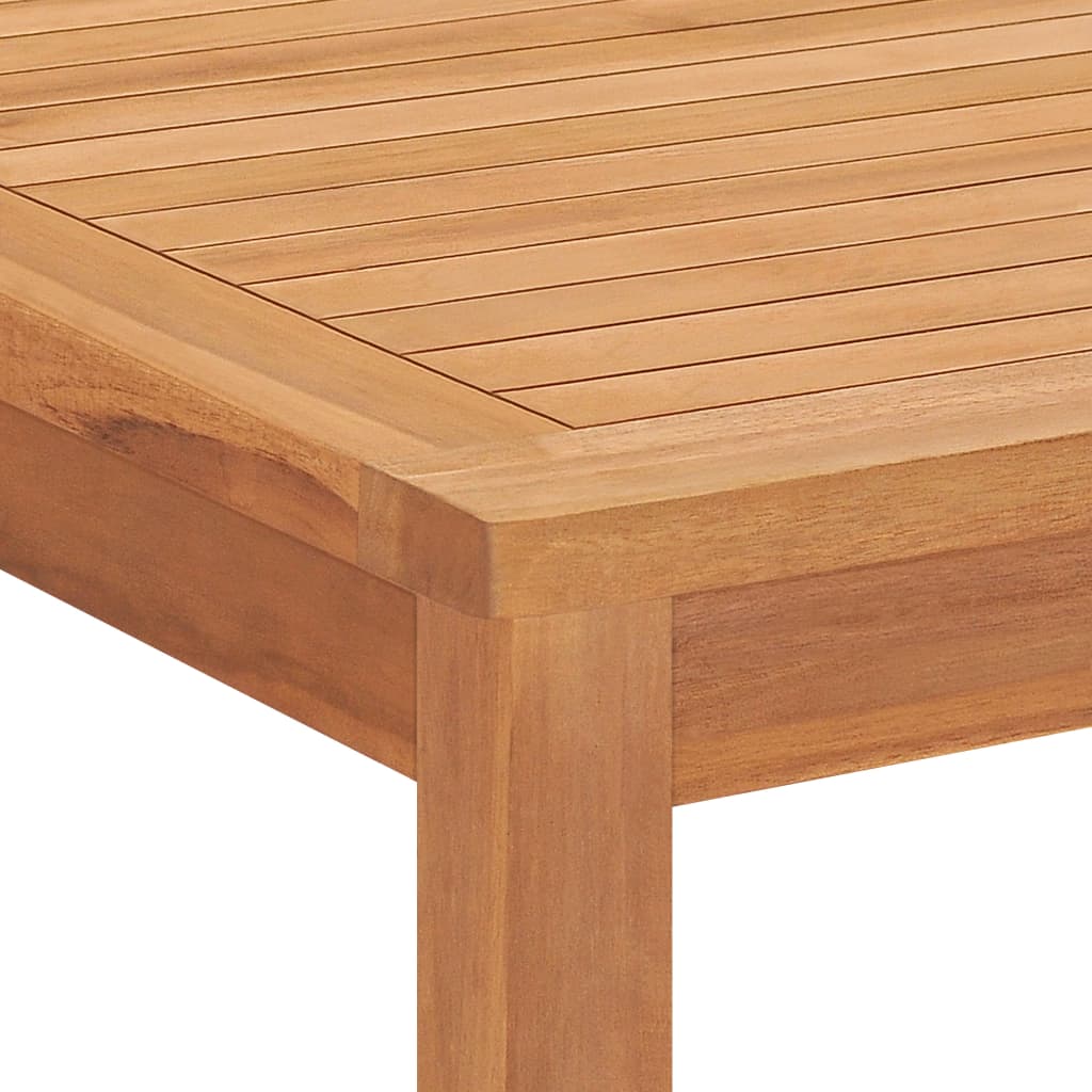 Close-up of the smooth surface and edges of a solid teak wood dining table, showcasing its natural grain and craftsmanship.