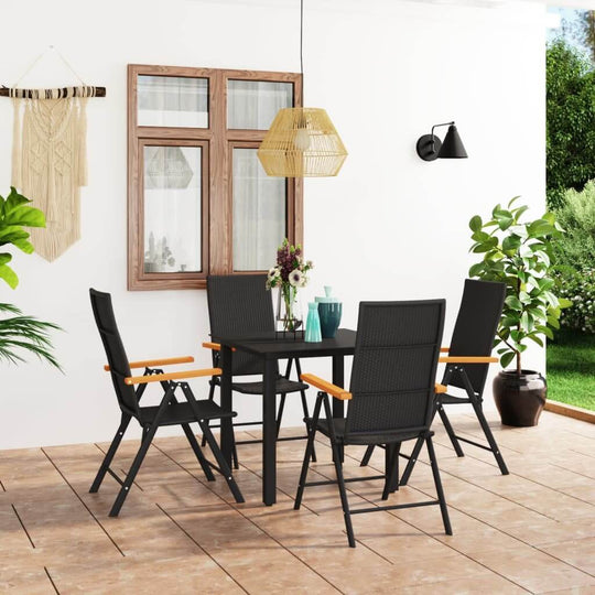 5-piece garden dining set with brown WPC armrests, black PE rattan chairs, and glass-top table on a home patio. Perfect outdoor furniture.