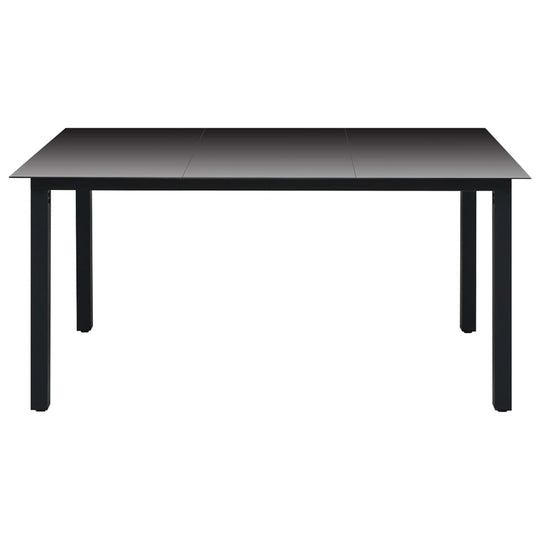 Black rectangular garden dining table with a glass top, designed for outdoor use and easy cleaning.