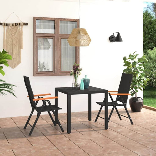 3 piece black and brown garden dining set on a patio with stylish chairs and a rectangular table, surrounded by greenery.