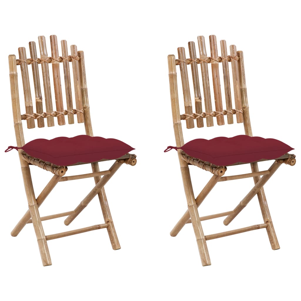 Set of 2 folding bamboo garden chairs with red cushions, perfect for outdoor dining and lounging.