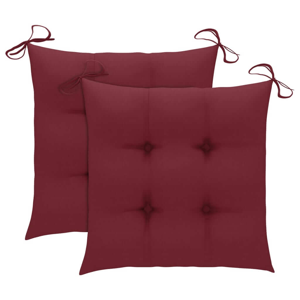 Pair of burgundy seat cushions with ties for added comfort in outdoor furniture.