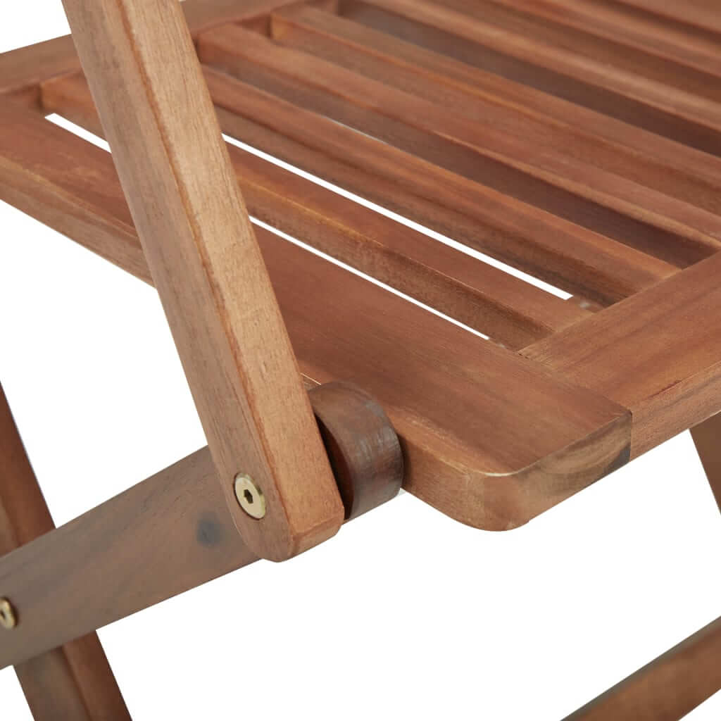 Close-up of solid acacia wood folding garden chair showcasing slatted design and sturdy construction for outdoor use.