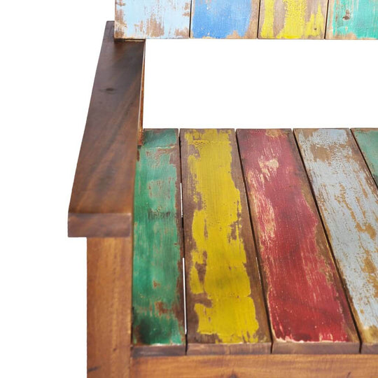 Vintage-style bench with multicolored reclaimed wood slats, perfect for outdoor furniture and adding character to any lounge space.