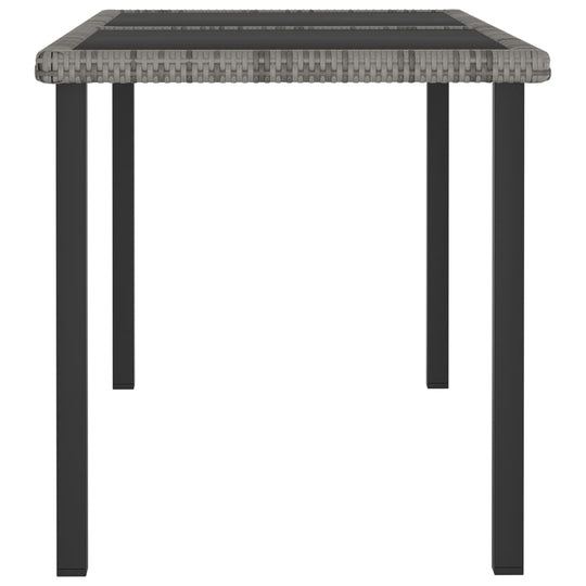 Garden dining table with grey poly rattan design and sturdy black steel legs, perfect for outdoor furniture settings.