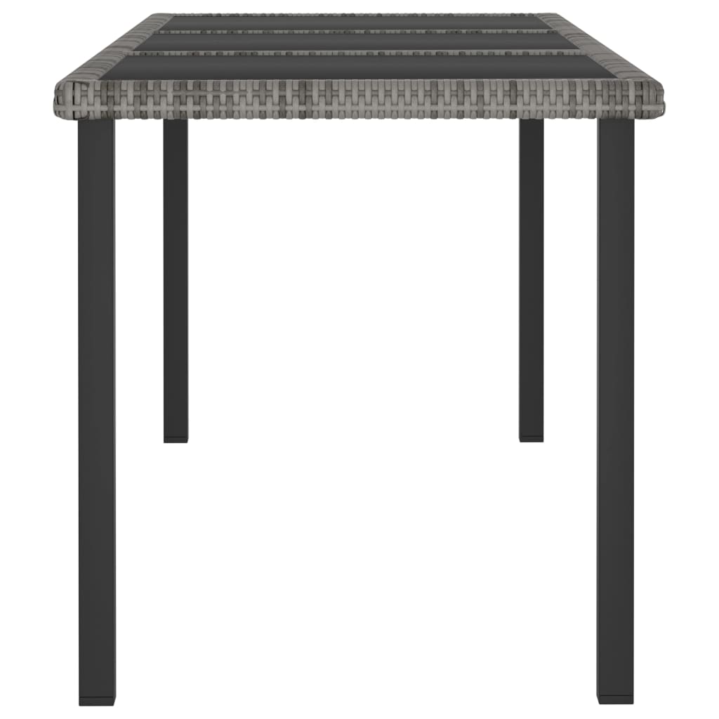 Front view of a grey poly rattan dining table with sturdy black steel legs, designed for outdoor garden use.