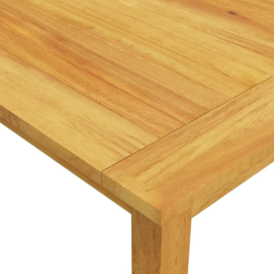 Close-up of the solid acacia wood tabletop with an oil finish, showcasing its natural grain and durability.