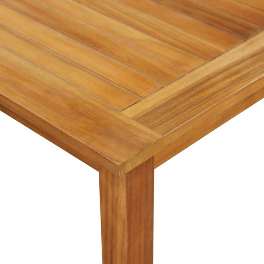 Close-up of the solid acacia wood dining table top showcasing its durable, oil-finished surface, perfect for outdoor furniture.