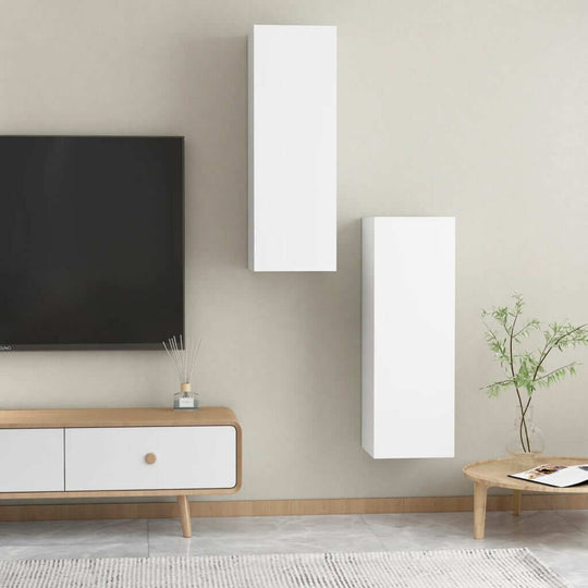 Modern white wall-mounted TV cabinets with TV setup, perfect for stylish living room furniture and organization.