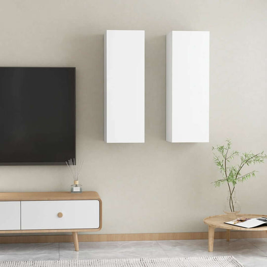 Modern white wall-mounted TV cabinets in a stylish living room setting with minimalist decor and furniture.