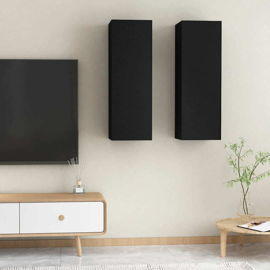 Black wall-mounted TV cabinets in a modern living room with a stylish design and engineered wood finish.