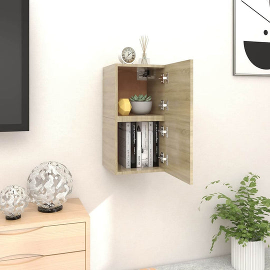 Wall-mounted TV cabinet in Sonoma oak with open doors, displaying books and plants, ideal for modern furniture decor.