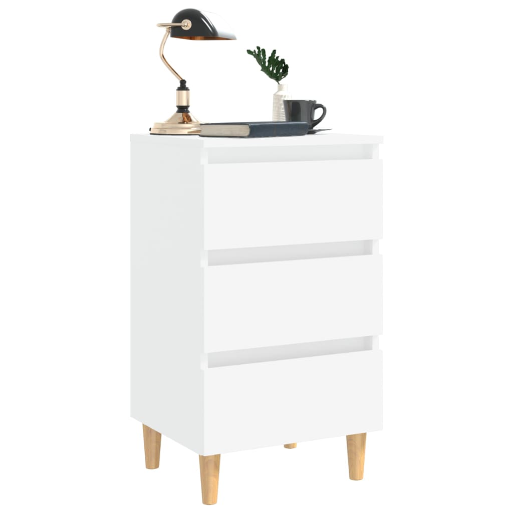 Stylish white bed cabinet with solid wood legs and three drawers, perfect for bedroom organization and Scandinavian decor.