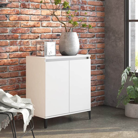 Sideboard in white engineered wood with metal legs, displayed in a modern room with brick wall and potted plant.