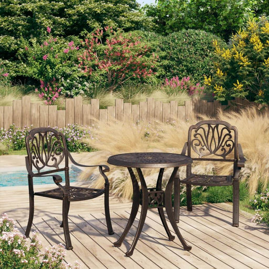 3 piece cast aluminium bronze bistro set with elegant patterns in a garden setting, perfect for outdoor enjoyment.