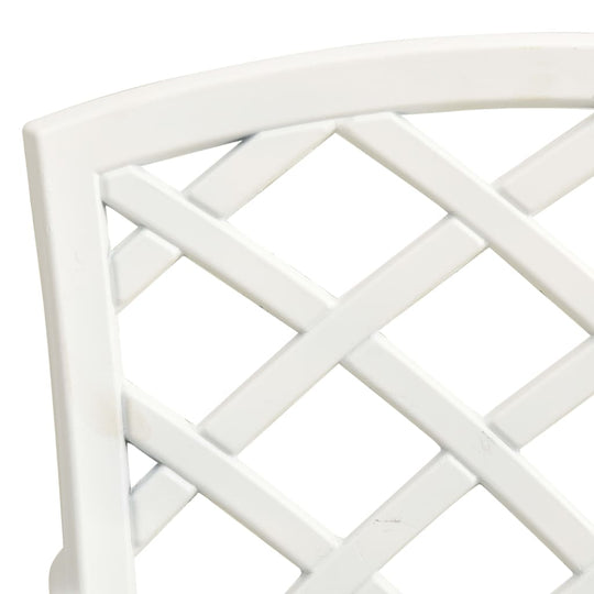 Close-up of white cast aluminium bistro chair backrest showcasing elegant lattice design.