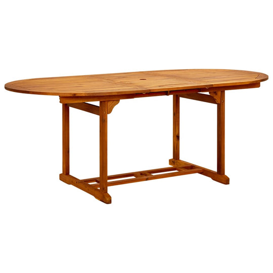 Oval acacia wood dining table ideal for outdoor use, featuring a sturdy frame and oil-finished surface.