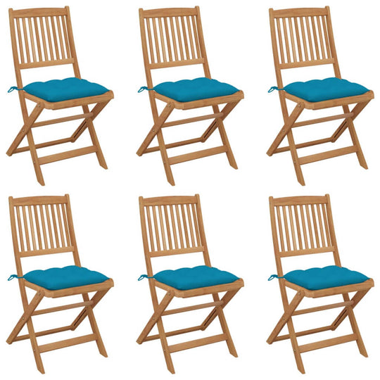 Set of 6 folding garden chairs made of solid acacia wood with blue cushions for outdoor relaxation.