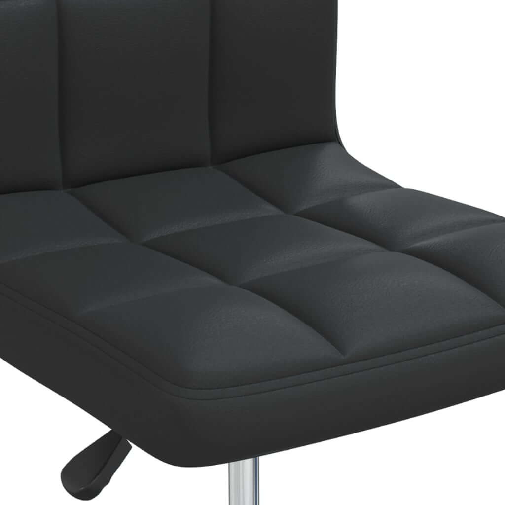 Close-up of a black faux leather bar stool seat with tufted design and chrome gas lift mechanism for adjustable height.