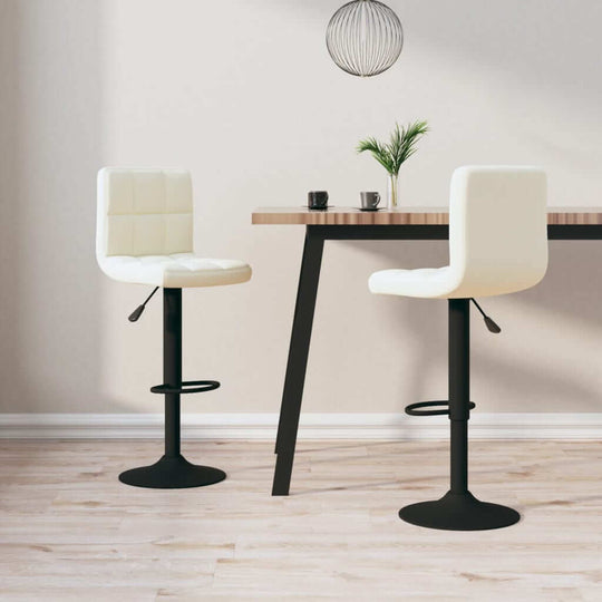 Cream velvet bar stools with chrome base set beside a modern wooden table, perfect for outdoor patio or garden furniture.