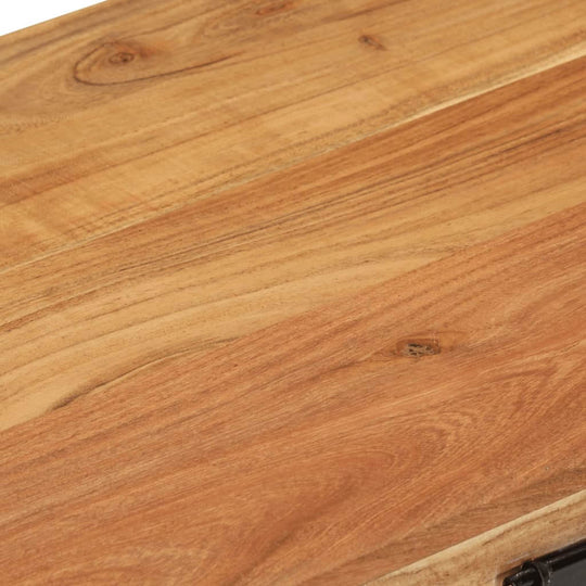 Close-up of solid acacia wood surface of a storage chest, showcasing its rich grain and texture.