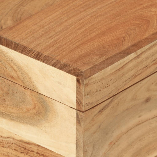 Close-up of solid acacia wood surface, showcasing grain and craftsmanship of a classic storage chest.