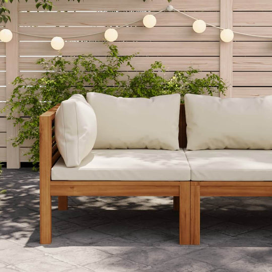 Sectional corner sofa with cream cushions made of acacia wood, perfect for outdoor use in a stylish setting.