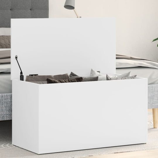 White storage chest with pillows inside, perfect for organizing essentials in a stylish living space.