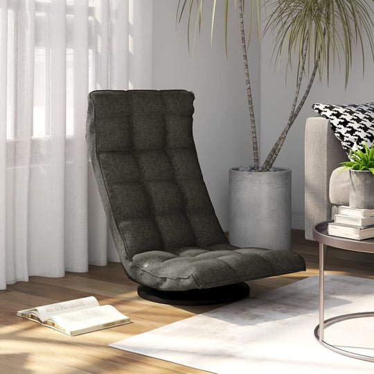 Swivel floor chair in dark grey fabric, perfect for outdoor living space and home comfort, set in a stylish room environment.