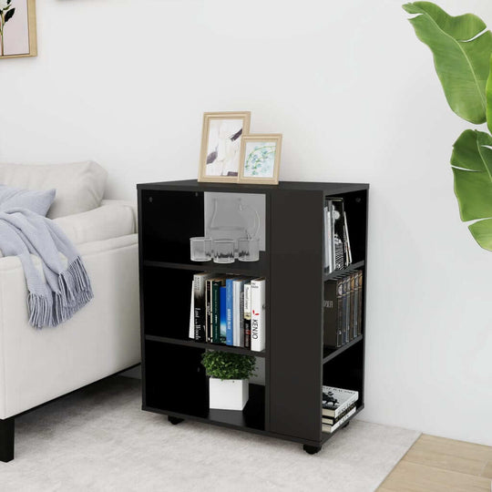 Modern black rolling cabinet with shelves, books, and decor, perfect for organizing and saving space in any room.