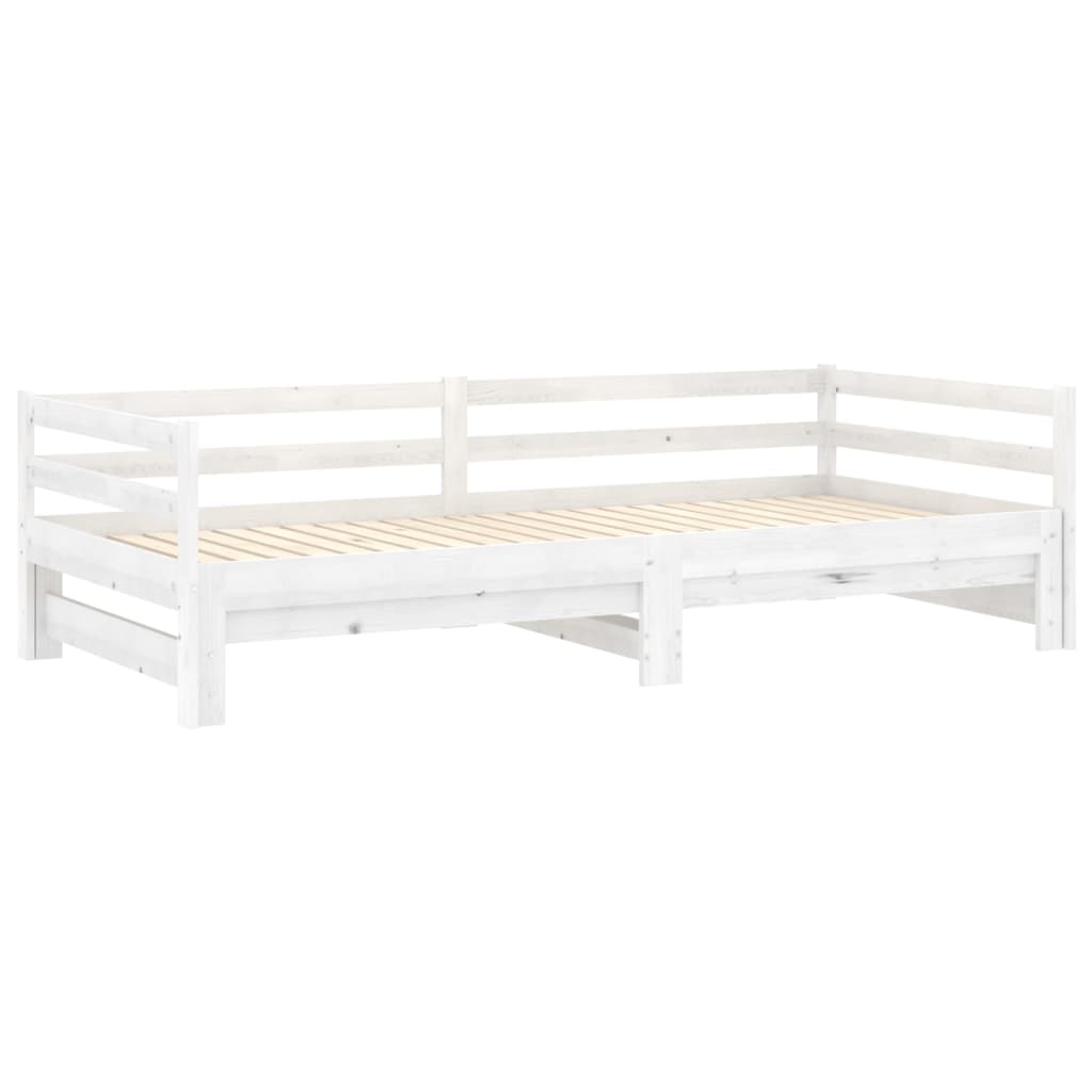 Pull-out day bed in solid pinewood with colorful cushions, versatile for use as a sofa or bed, ideal for small spaces