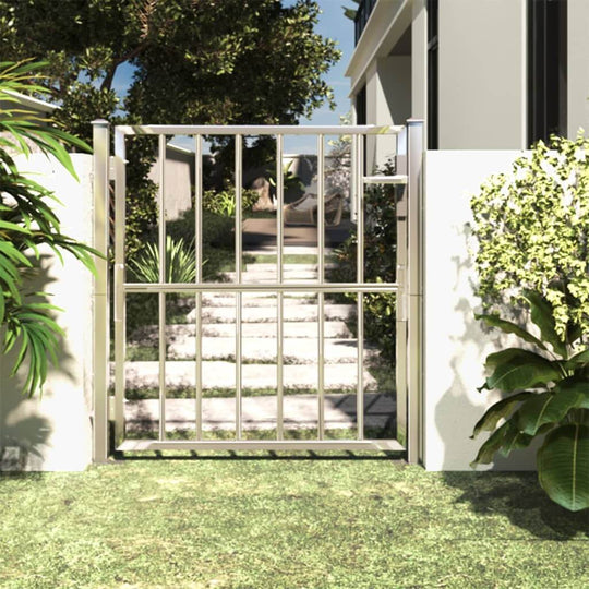 Contemporary stainless steel garden gate providing a secure entryway to an outdoor living space.