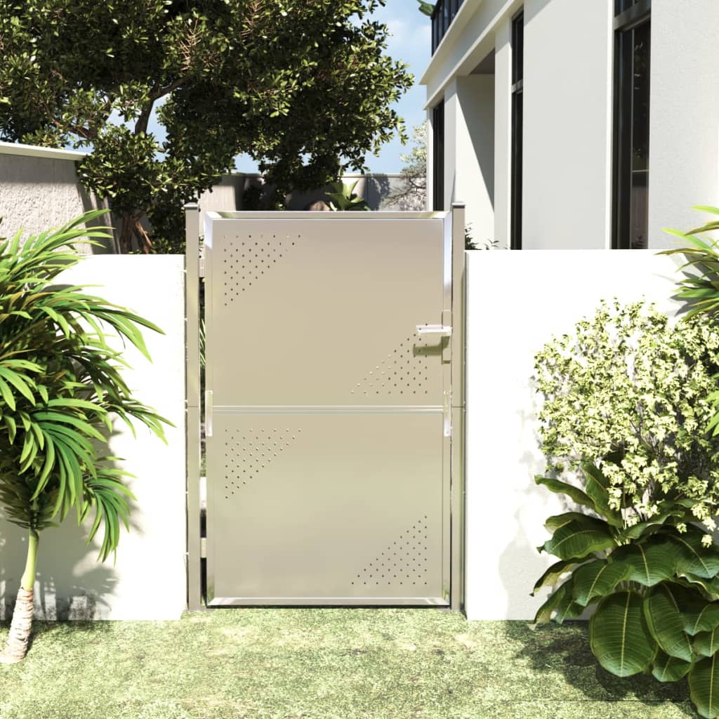 Stainless steel garden gate providing stylish entry to outdoor living space, surrounded by greenery and private fencing.