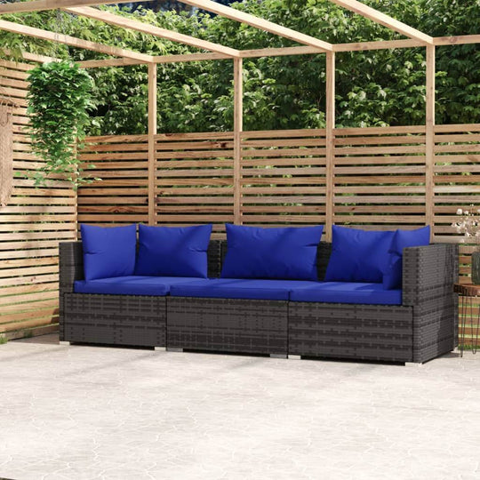 Outdoor 3-seater poly rattan sofa with blue cushions on patio, ideal for garden and outdoor living spaces.