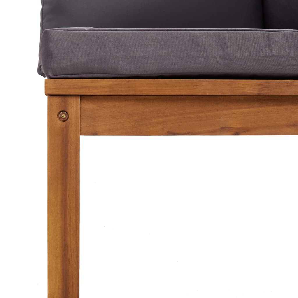 Close-up of solid acacia wood frame and thick cushion of a stylish outdoor lounge set for garden relaxation.