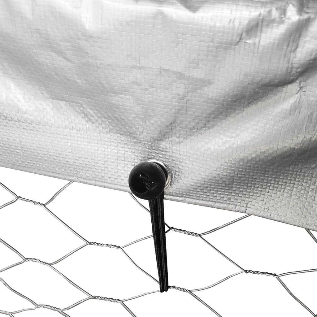 Close-up of the secure fastening and mesh of an outdoor dog kennel, highlighting durability and safety for pets.