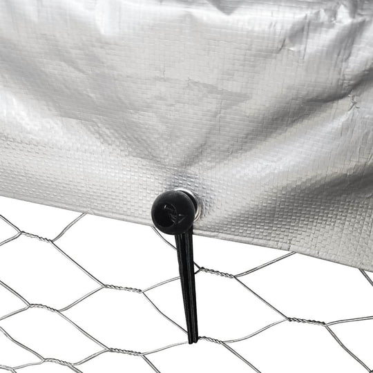 Close-up of the securing mechanism on the roof of an outdoor dog kennel, showcasing mesh and waterproof material.