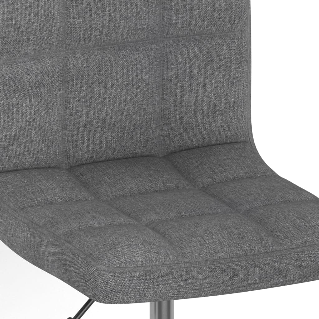 Light grey fabric swivel dining chair with a modern design and comfortable cushioned seat.